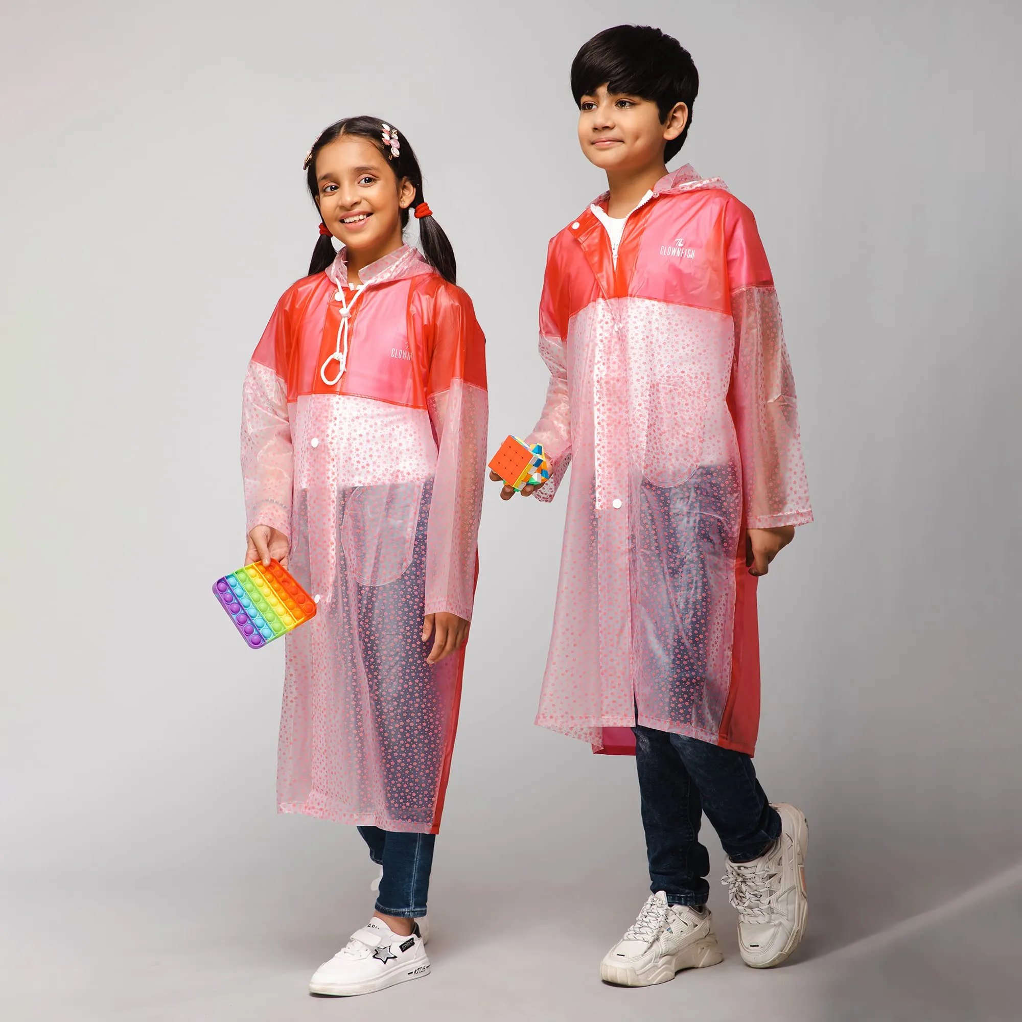 THE CLOWNFISH Misty Magic Series Unisex Kids Waterproof Single Layer PVC Longcoat/Raincoat with Adjustable Hood. Age-6-7 Years (Rose Red)